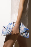 Medium folded leather clutch with blue floral print